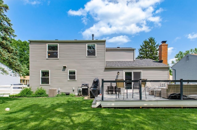 6407 Skywae Dr, Columbus, OH 43229 - rear view of house featuring a yard, a wooden deck, and a chimney