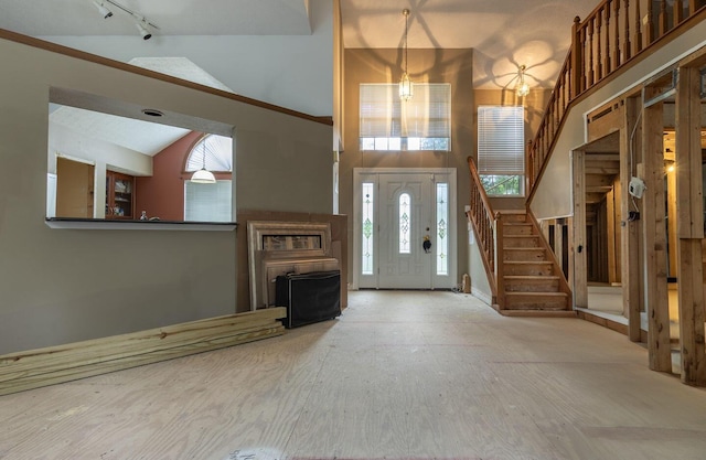 7711 Eagle Creek Dr, Pickerington, OH 43147 - entryway with stairway, high vaulted ceiling, and rail lighting