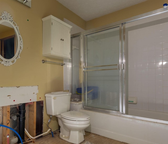 7711 Eagle Creek Dr, Pickerington, OH 43147 - bathroom featuring toilet and bath / shower combo with glass door