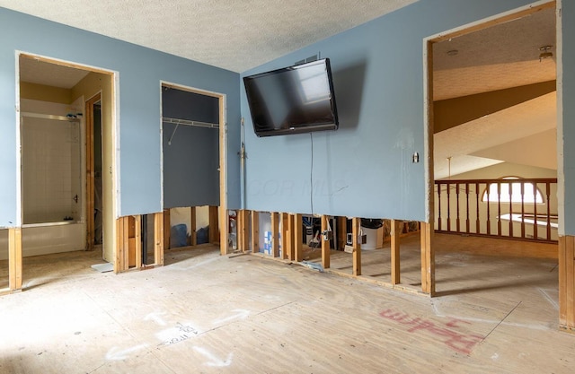 7711 Eagle Creek Dr, Pickerington, OH 43147 - unfurnished living room featuring a textured ceiling