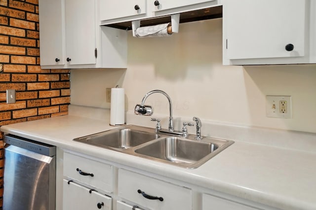 3784 Hendron Rd, Groveport, OH 43125 - kitchen featuring stainless steel dishwasher, a sink, light countertops, white cabinets, and decorative backsplash