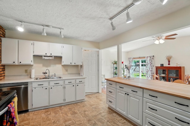 3784 Hendron Rd, Groveport, OH 43125 - kitchen featuring a sink, rail lighting, white cabinetry, a ceiling fan, and a textured ceiling