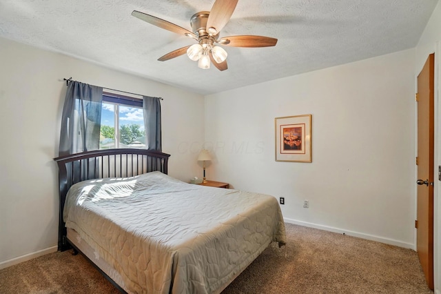 3784 Hendron Rd, Groveport, OH 43125 - bedroom with carpet, baseboards, a textured ceiling, and ceiling fan