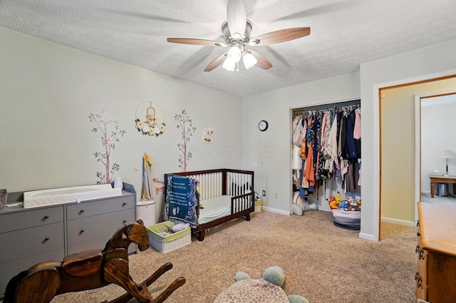 3784 Hendron Rd, Groveport, OH 43125 - carpeted bedroom with a textured ceiling, baseboards, a closet, and a ceiling fan