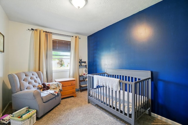 3784 Hendron Rd, Groveport, OH 43125 - bedroom featuring light colored carpet, a crib, and a textured ceiling