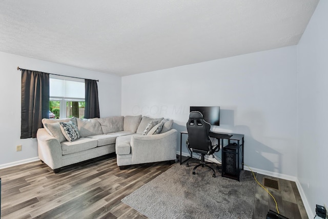 566 Harding Ln, Delaware, OH 43015 - living room featuring wood finished floors, baseboards, and an office area