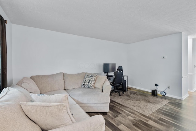 566 Harding Ln, Delaware, OH 43015 - living area with wood finished floors, a textured ceiling, and baseboards
