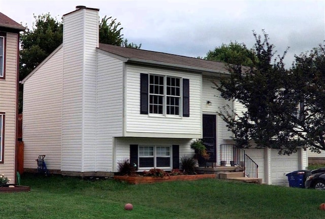 280 Chatterly Ln, Columbus, OH 43207 - view of front of home featuring a chimney, a front yard, and a garage