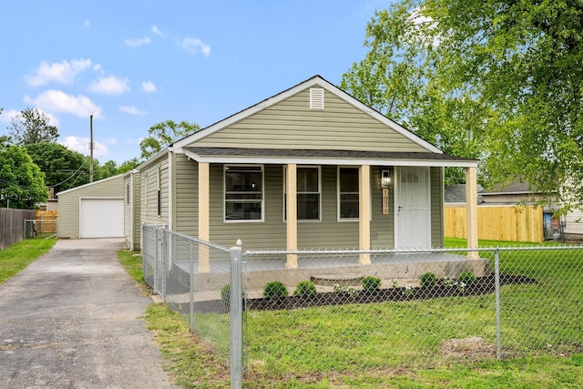 1006 Midland Ave, Columbus, OH 43223 - view of front of home featuring covered porch, a garage, and an outdoor structure