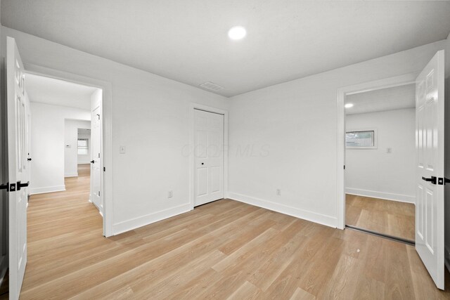1006 Midland Ave, Columbus, OH 43223 - unfurnished bedroom with light wood finished floors, baseboards, recessed lighting, and a closet