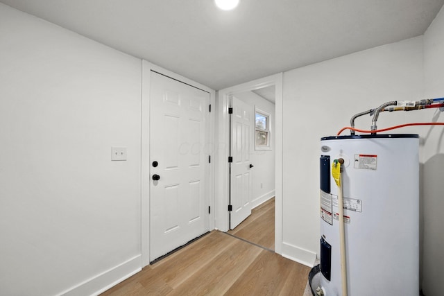 1006 Midland Ave, Columbus, OH 43223 - entrance foyer with water heater, light wood-style flooring, and baseboards
