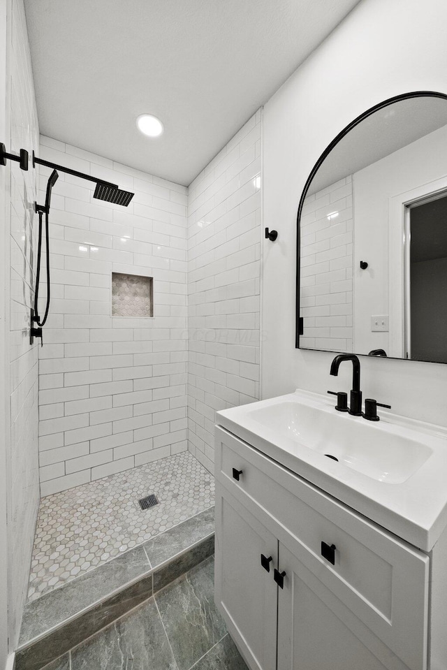 1006 Midland Ave, Columbus, OH 43223 - bathroom with vanity, a tile shower, and recessed lighting
