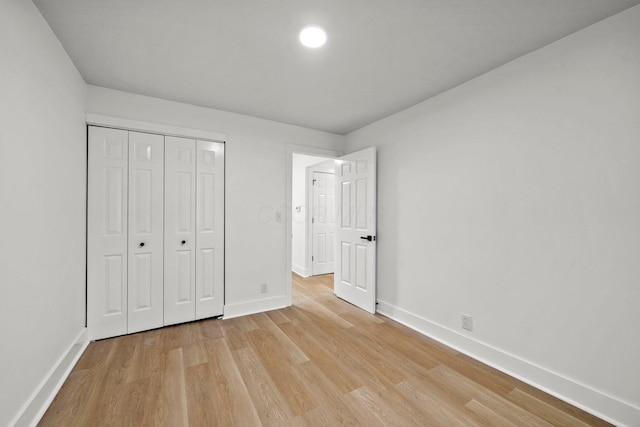 1006 Midland Ave, Columbus, OH 43223 - unfurnished bedroom featuring light wood-style floors, baseboards, and a closet