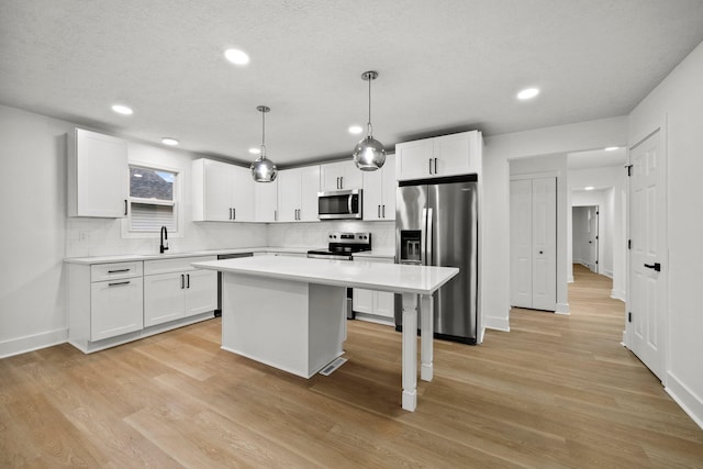 1006 Midland Ave, Columbus, OH 43223 - kitchen with stainless steel appliances, tasteful backsplash, light countertops, and recessed lighting