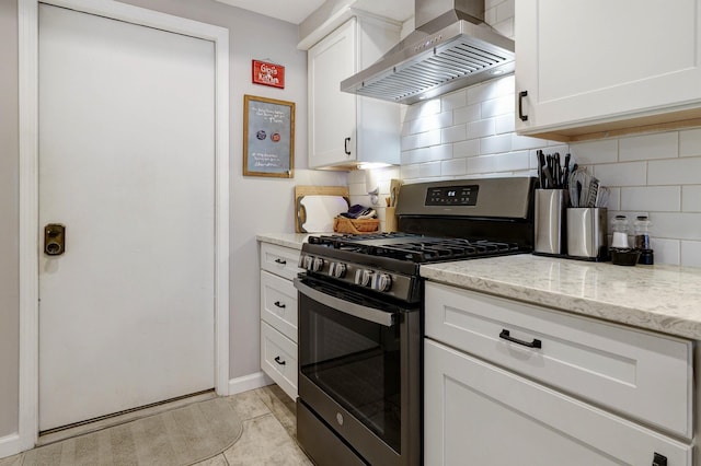 2539 Trotterslane Dr, Columbus, OH 43235 - kitchen featuring wall chimney exhaust hood, gas stove, tasteful backsplash, white cabinets, and light stone countertops