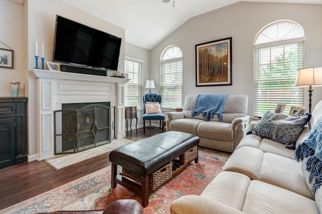 2539 Trotterslane Dr, Columbus, OH 43235 - living room featuring wood finished floors, a fireplace with flush hearth, and lofted ceiling