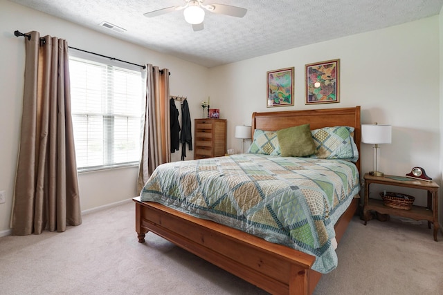 2539 Trotterslane Dr, Columbus, OH 43235 - bedroom featuring light colored carpet, a textured ceiling, baseboards, and ceiling fan
