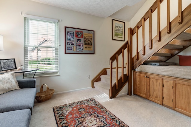 2539 Trotterslane Dr, Columbus, OH 43235 - staircase with carpet, healthy amount of natural light, baseboards, and a textured ceiling