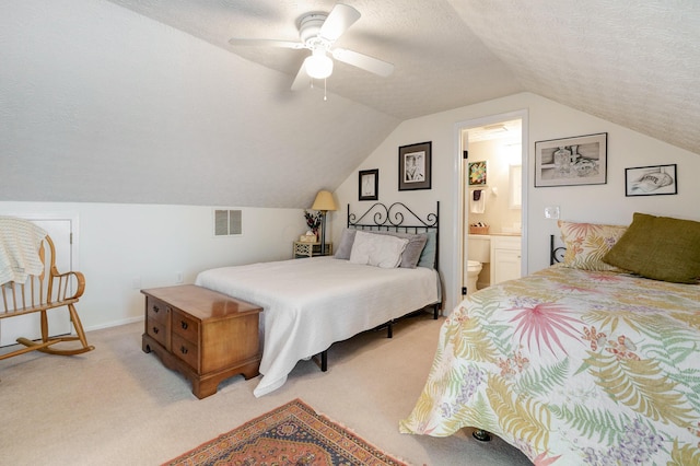 2539 Trotterslane Dr, Columbus, OH 43235 - bedroom featuring light colored carpet, vaulted ceiling, a textured ceiling, connected bathroom, and a ceiling fan