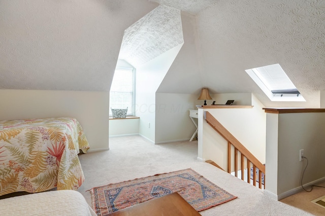 2539 Trotterslane Dr, Columbus, OH 43235 - bedroom with carpet flooring, a skylight, a textured ceiling, lofted ceiling, and baseboards