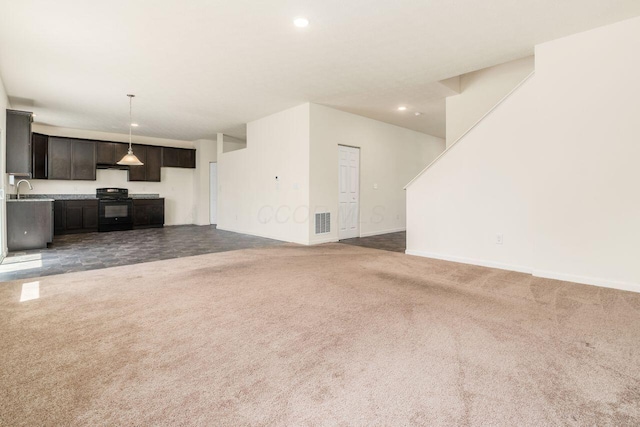 3339 Lauren Fields Dr S, Groveport, OH 43125 - unfurnished living room with dark carpet, a sink, recessed lighting, and baseboards