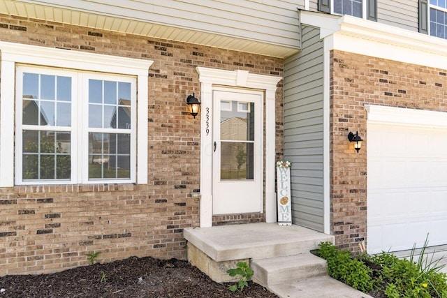 3339 Lauren Fields Dr S, Groveport, OH 43125 - property entrance featuring brick siding and a garage