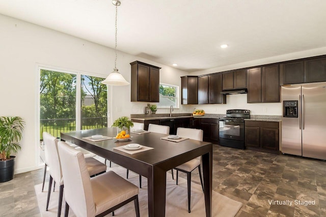 3339 Lauren Fields Dr S, Groveport, OH 43125 - kitchen featuring black appliances, dark brown cabinets, a sink, under cabinet range hood, and pendant lighting