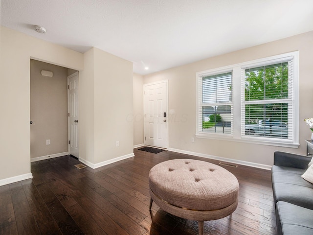 4783 Nieles Edge Dr, Columbus, OH 43232 - living room featuring baseboards and dark wood-style floors