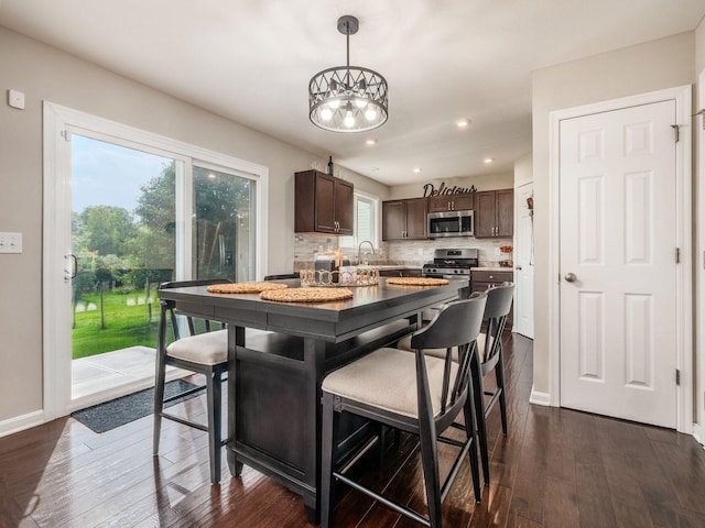 4783 Nieles Edge Dr, Columbus, OH 43232 - dining room with healthy amount of natural light, dark wood finished floors, and recessed lighting