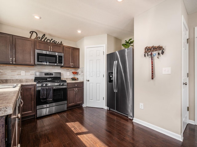 4783 Nieles Edge Dr, Columbus, OH 43232 - kitchen featuring appliances with stainless steel finishes, dark brown cabinets, dark wood finished floors, light countertops, and recessed lighting