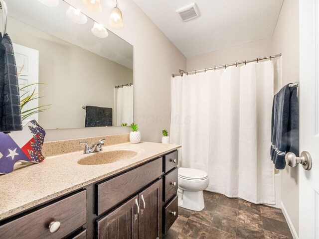 4783 Nieles Edge Dr, Columbus, OH 43232 - full bathroom with vanity, toilet, and stone finish floors