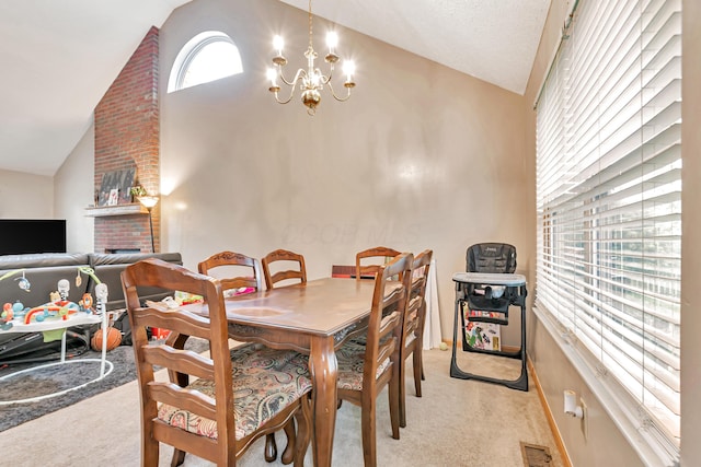 3150 Berkley Pointe Dr, Gahanna, OH 43230 - dining space with light carpet, a chandelier, baseboards, and high vaulted ceiling