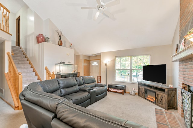 3150 Berkley Pointe Dr, Gahanna, OH 43230 - living room featuring a glass covered fireplace, carpet flooring, ceiling fan, stairs, and high vaulted ceiling