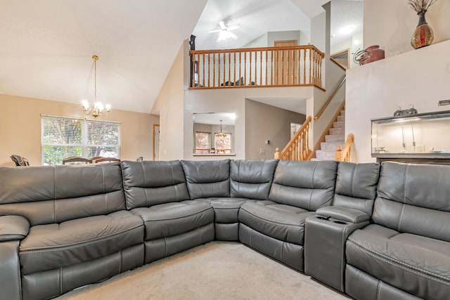 3150 Berkley Pointe Dr, Gahanna, OH 43230 - carpeted living area featuring high vaulted ceiling, a chandelier, stairway, and a ceiling fan