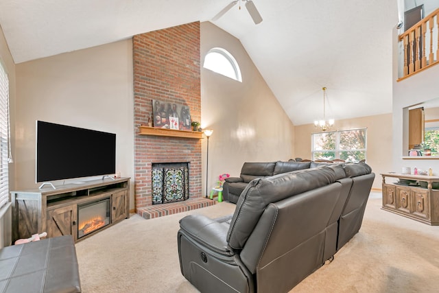 3150 Berkley Pointe Dr, Gahanna, OH 43230 - living room with a brick fireplace, carpet flooring, high vaulted ceiling, a chandelier, and healthy amount of natural light