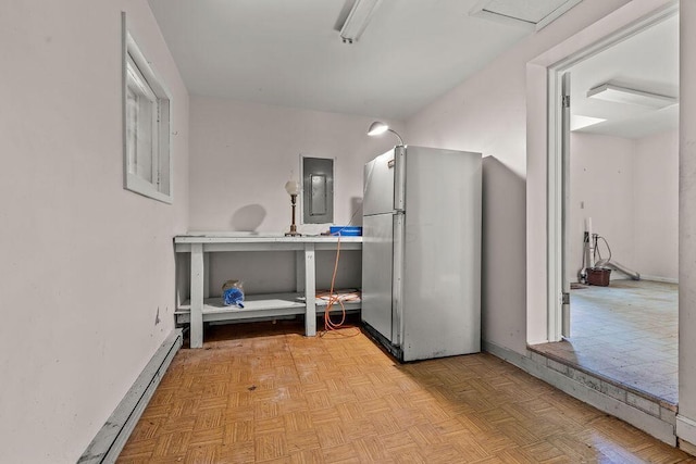 4093 State Route 257, Radnor, OH 43066 - kitchen featuring freestanding refrigerator, electric panel, and a baseboard radiator