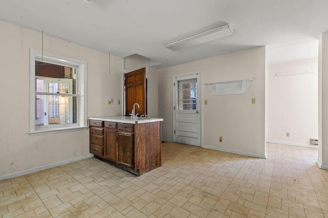4093 State Route 257, Radnor, OH 43066 - kitchen with brick patterned flooring, light countertops, and a peninsula