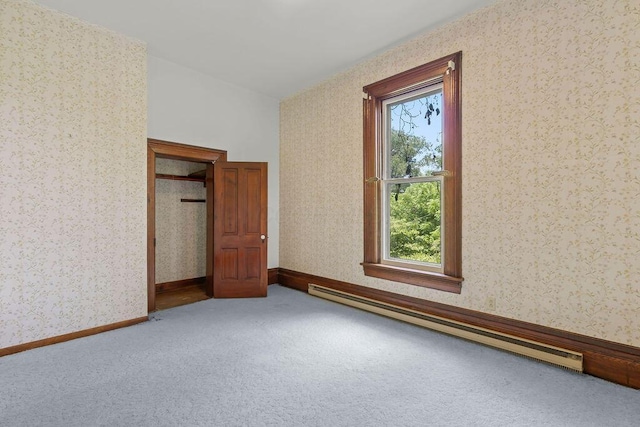 4093 State Route 257, Radnor, OH 43066 - unfurnished bedroom featuring baseboard heating, wallpapered walls, and carpet