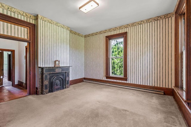4093 State Route 257, Radnor, OH 43066 - unfurnished living room with wallpapered walls, a baseboard heating unit, and carpet flooring