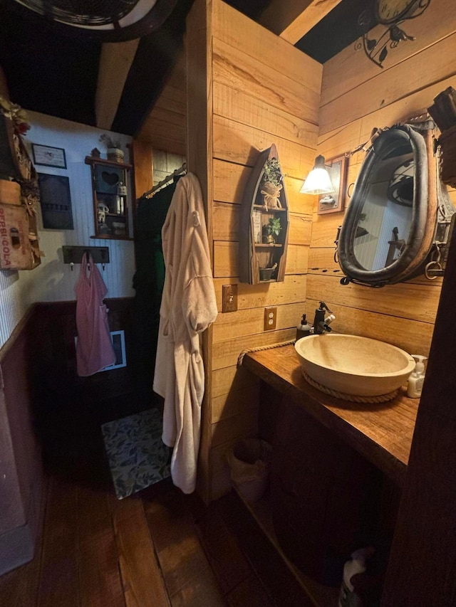 2309 N Houston Pike, South Vienna, OH 45369 - bathroom featuring wooden walls, vanity, and wood finished floors