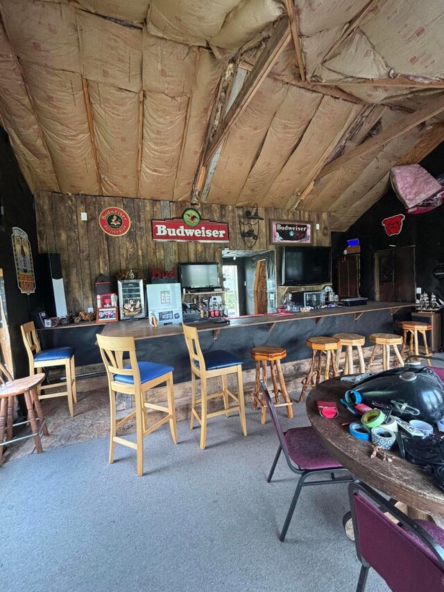 2309 N Houston Pike, South Vienna, OH 45369 - dining area featuring carpet floors, a bar, and vaulted ceiling