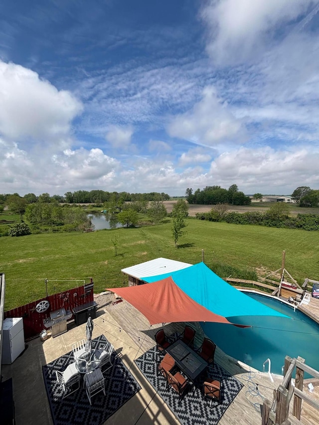 2309 N Houston Pike, South Vienna, OH 45369 - swimming pool with a yard, a rural view, a water view, and outdoor dining area