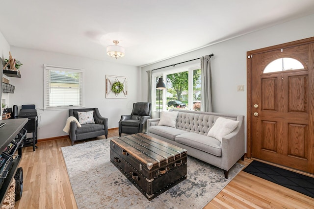 2380 Cranford Rd, Upper Arlington, OH 43221 - living area featuring healthy amount of natural light, light wood-style flooring, and baseboards