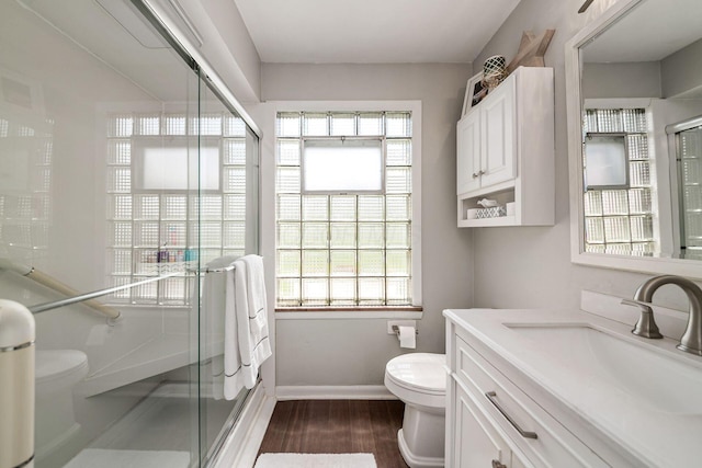2380 Cranford Rd, Upper Arlington, OH 43221 - full bath featuring toilet, vanity, a stall shower, wood finished floors, and baseboards