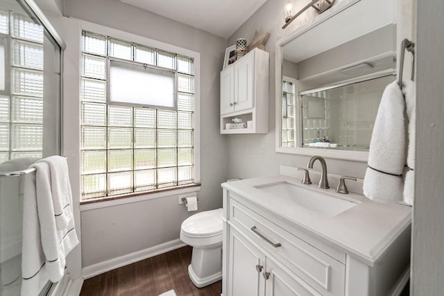 2380 Cranford Rd, Upper Arlington, OH 43221 - full bathroom featuring toilet, a stall shower, wood finished floors, vanity, and baseboards