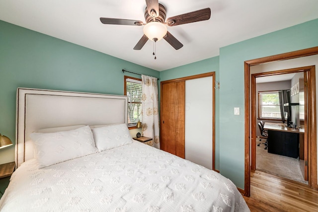 2380 Cranford Rd, Upper Arlington, OH 43221 - bedroom featuring wood finished floors, multiple windows, a closet, and ceiling fan