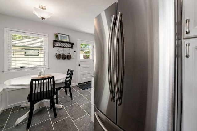 2380 Cranford Rd, Upper Arlington, OH 43221 - kitchen featuring freestanding refrigerator, light countertops, baseboards, and white cabinetry