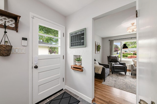 2380 Cranford Rd, Upper Arlington, OH 43221 - doorway to outside featuring baseboards and wood finished floors