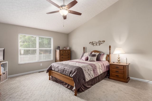 4989 Edgeley Dr, Hilliard, OH 43026 - bedroom with light colored carpet, baseboards, vaulted ceiling, ceiling fan, and a textured ceiling