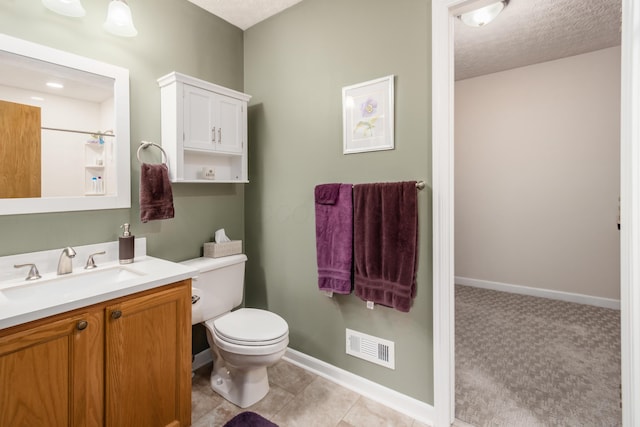 4989 Edgeley Dr, Hilliard, OH 43026 - bathroom with toilet, vanity, baseboards, and a textured ceiling